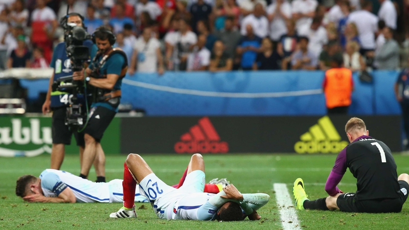 Joe Hart, Dele Alli and Gary Cahill of England lie dejected at the end of the game