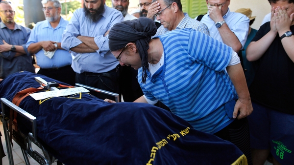 The mother of Hallel Yaffa Ariel mourns at her funeral