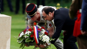 President Francois Hollande lays a wreath