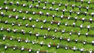 Children lay wreaths at the graves of those killed during the Battle of the Somme