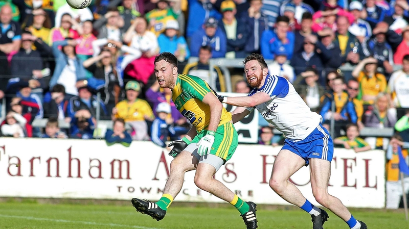 Donegal's Martin McElhinney with Monaghan's Owen Duffy