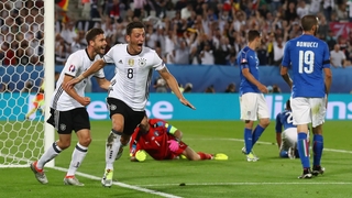 Mesut Ozil celebrates his goal, which gave Germany the lead in normal time