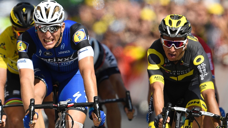 Marcel Kittel (blue, left) crosses the finish line ahead of Bryan Coquard (R) and Slovakia's Peter Sagan
