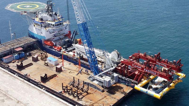 An aerial view on the transport structure with the salvaged migrant boat
