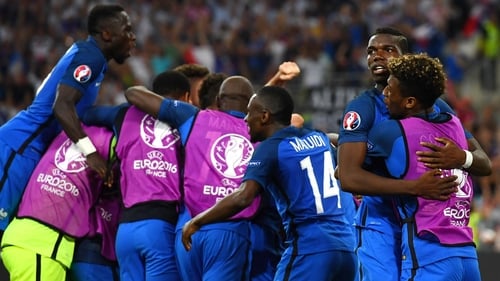 France players swamp Antoine Griezmann after his second goal