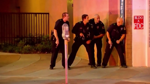 Officers took cover as shots rang out in downtown Dallas