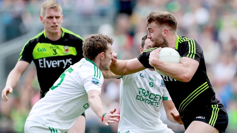 Fermanagh’s Declan McCusker and Damian Kelly with Aidan O’Shea of Mayo
