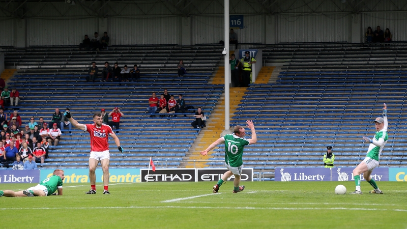 Cork's Peter Kelleher scores a goal past Limerick goalkeeper Donal O’Sullivan