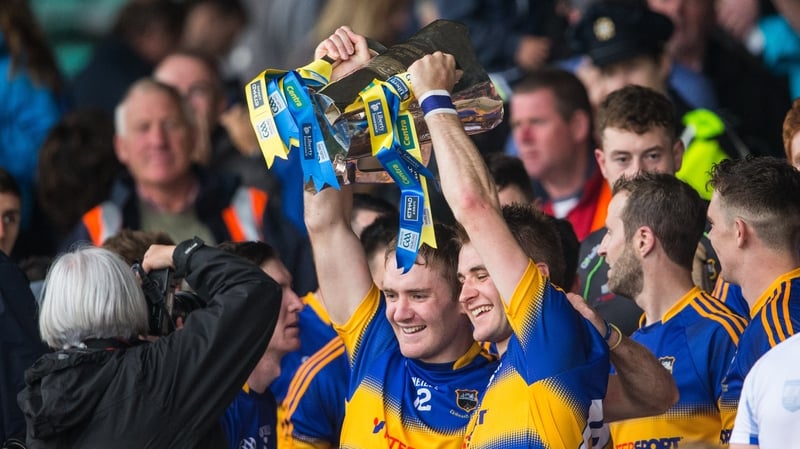 Brothers Noel and John McGrath lift the trophy