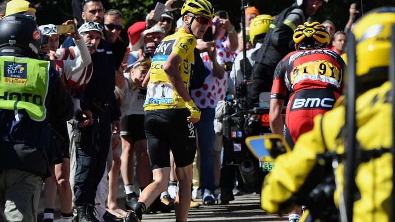 Froome was forced to run up the mountain after his bike is damaged in a crash