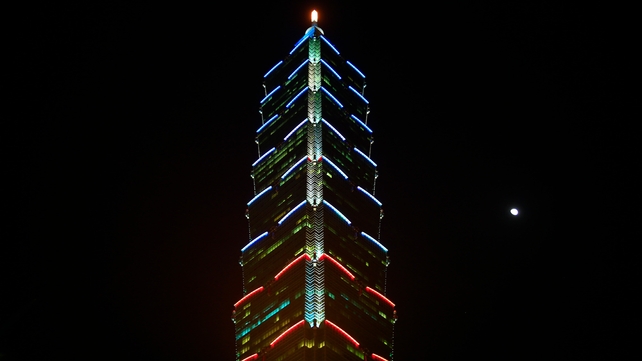Taipei 101 in Taiwan is lit in the colors of the French flag