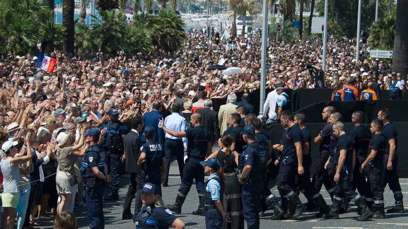 French firemen are congratulated by the crowds