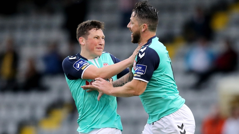 Conor McDermott celebrates with Derry goalscorer Rory Patterson