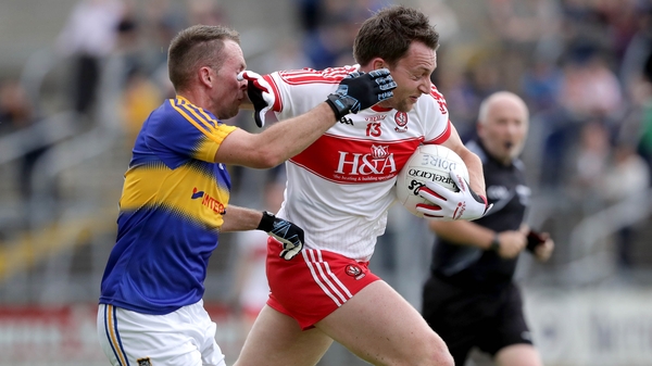 Derry's James Kielt fends off Tipp's Peter Acheson