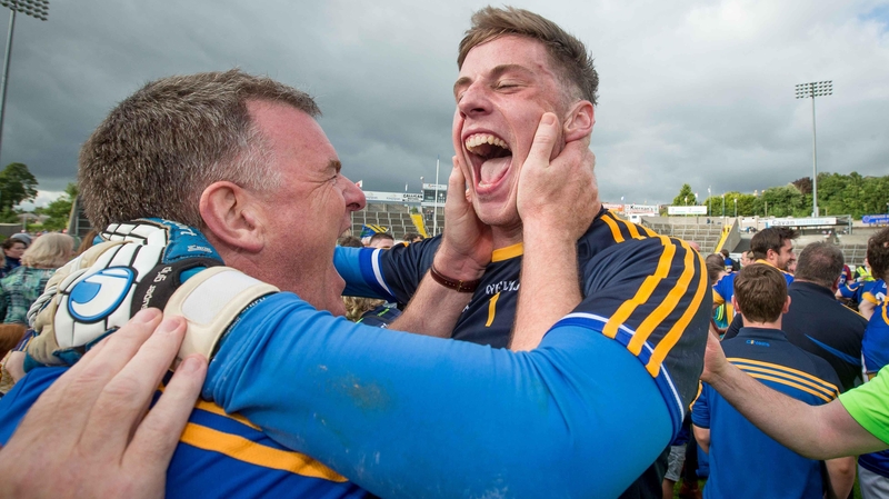 Tipperary manager Liam Kearns celebrates a famous win with Evan Comerford