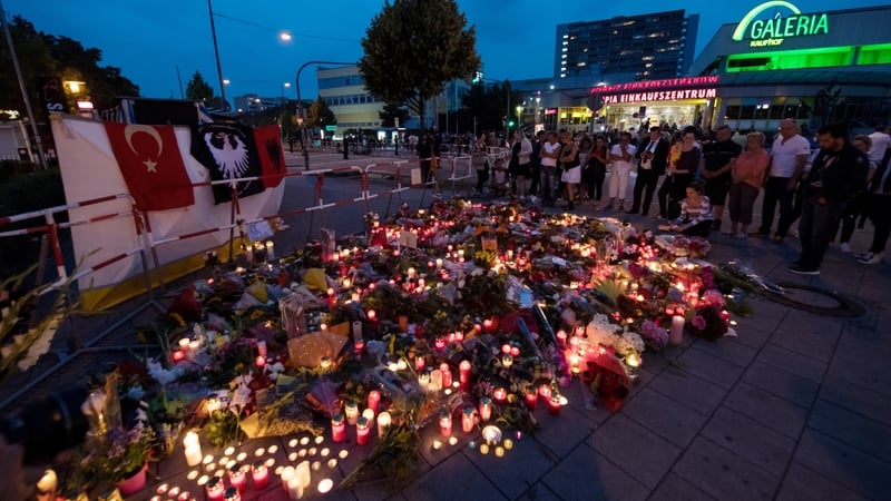 Flowers and candles are left at the scene of yesterday' attack