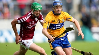 Podge Collins (R) evades Adrian Tuohy