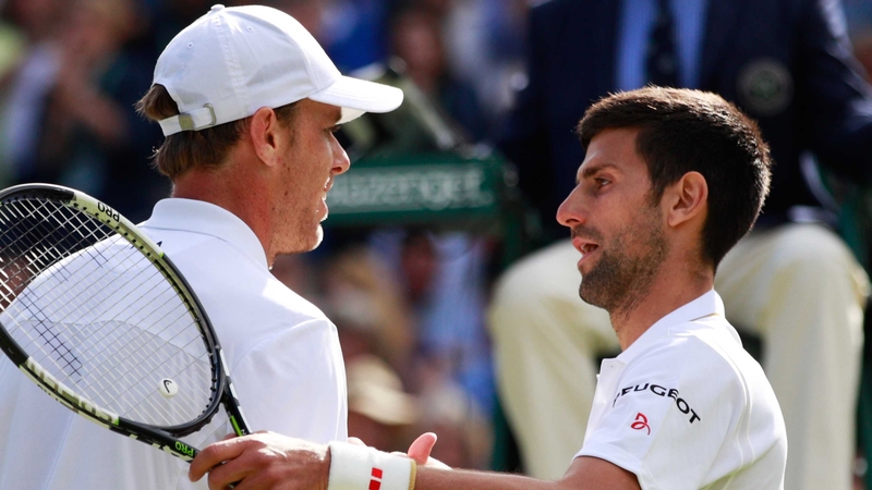 Sam Querrey with Novak Djokovic after his surprise defeat