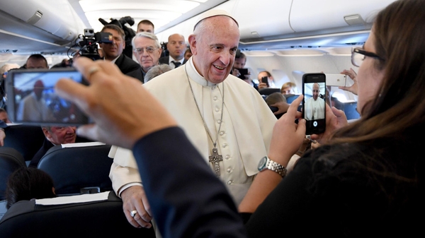 Pope Francis on board a plane during his flight to Balice Airport in Krakow, Poland