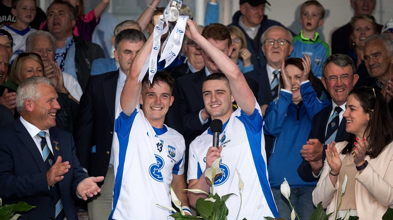 Waterford captains Patrick Curran and Adam Farrell lift the trophy