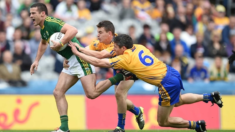 Kerry's Shane Enright tries to shake off Martin McMahon and Gordon Kelly