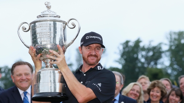 Jimmy Walker hoists the Wanamaker Trophy after landing his maiden major in New Jersey