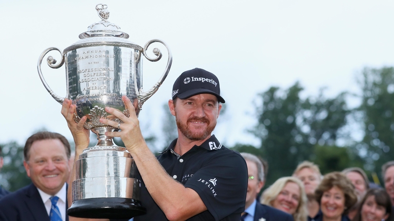 Jimmy Walker hoists the Wanamaker Trophy after landing his maiden major in New Jersey
