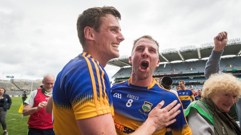 Peter Acheson celebrates with team-mate Conor Sweeney on the Croke Park sod after the win over Galway
