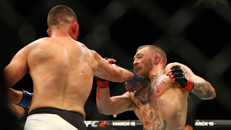 Nate Diaz lands a shot on Conor McGregor during their first meeting in Las Vegas