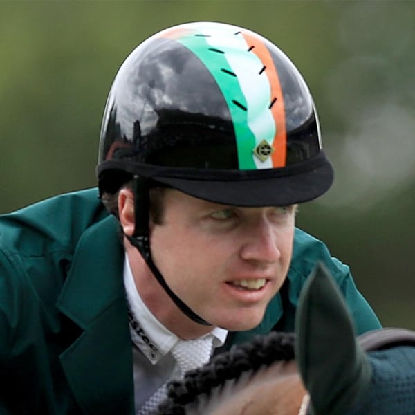 Broderick celebrates with the Aga Khan Cup after last year's win at the Dublin Horse Show