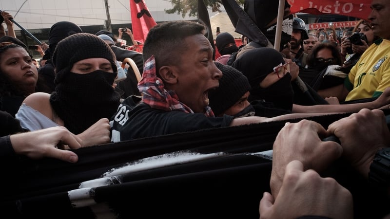 Stun grenades and tear gas were used to clear protesters