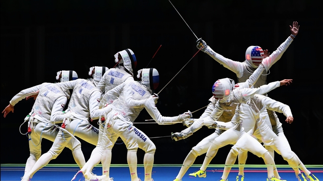En garde! A multiple exposure image of American Alexander Massialas during his defeat of Russia's Artur Akhmatkhuzin in the men's Individual Foil