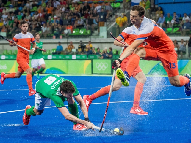 Ireland's Chris Cargo clashes with Sander Baart of the Netherlands. The Green Machine lost 5-0 in their Pool B game