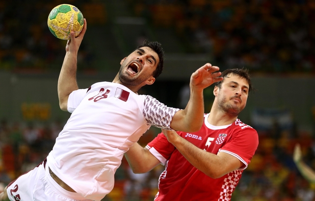 Are you not entertained! Kamal Aldin Mallash of Qatar lets out a passionate roar during the Men's Preliminary Group A match against Croatia