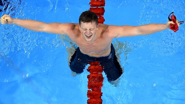 An overjoyed Adam Peaty celebrates his victory