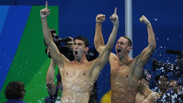 Michael Phelps (L) celebrates yet another gold medal
