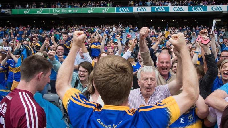 Tipp fans cheer on their footballers after beating Galway