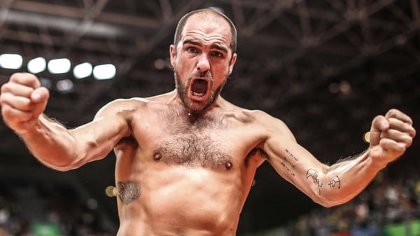 Scott Evans celebrates in trademark fashion after a big win in Rio