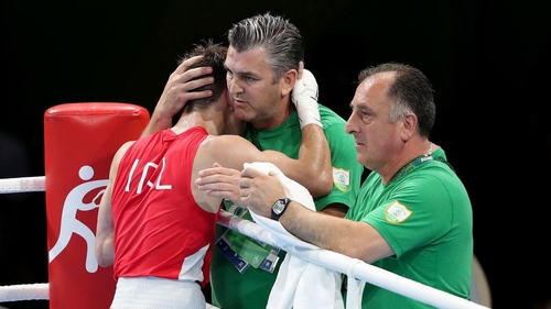 John Conlan embraces his son Michael after his opening victory in Rio