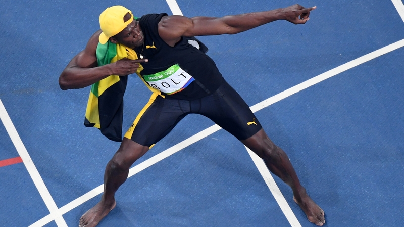 Usain Bolt celebrates his win