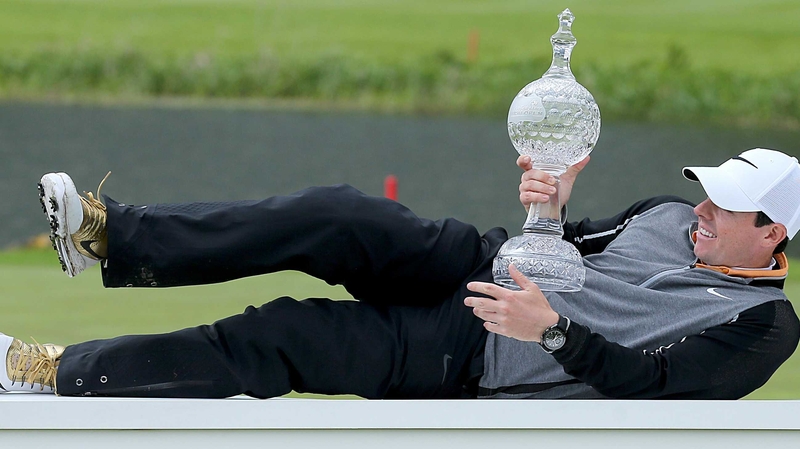 Rory McIlroy relaxes with the Irish Open trophy