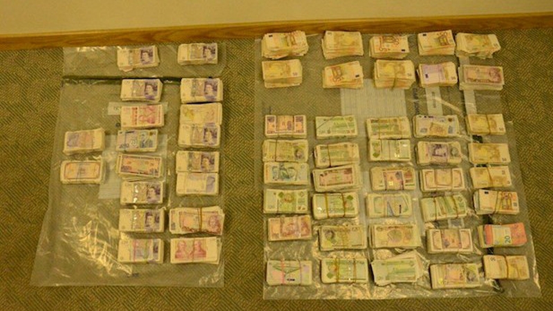 Bundles of cash were recovered during the arrest (pic: PSNI)