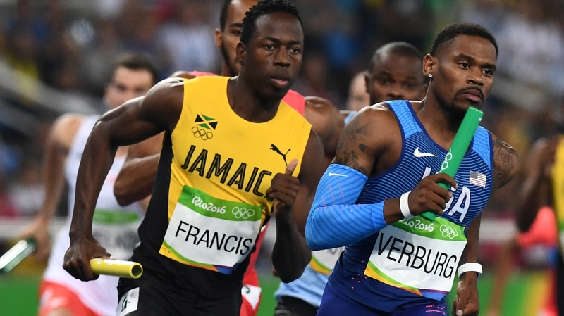Jamaica's Javon Francis and USA's David Verburg compete in the Men's 4x400m Relay Round 1