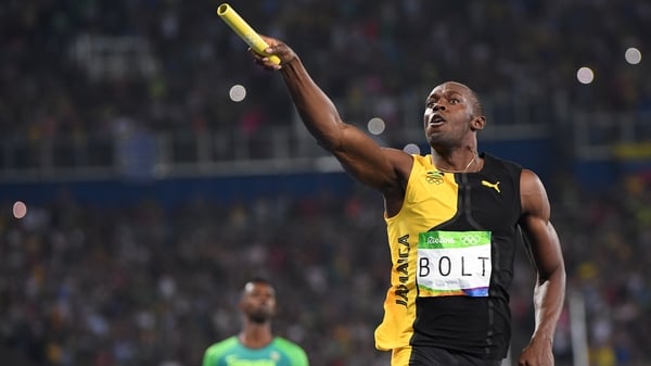 Usain Bolt celebrates after running the anchor leg for Jamaica