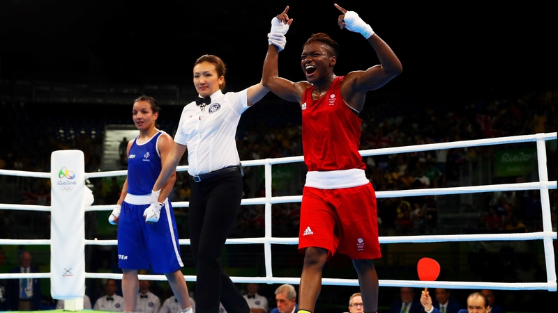 Nicola Adams has her arm raised aloft in Rio