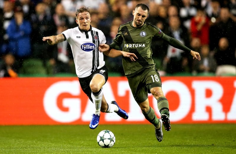 Dundalk's John Mountney battles for possession against Michał Kucharczyk of Legia Warsaw