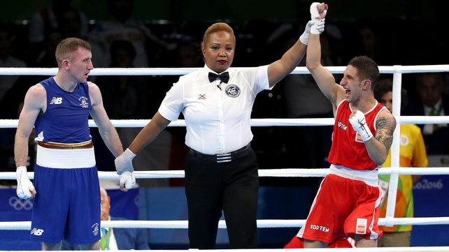 Paddy Barnes fell at the first hurdle after a surprise split-decision defeat to Spain's Samuel Carmona Heredia.