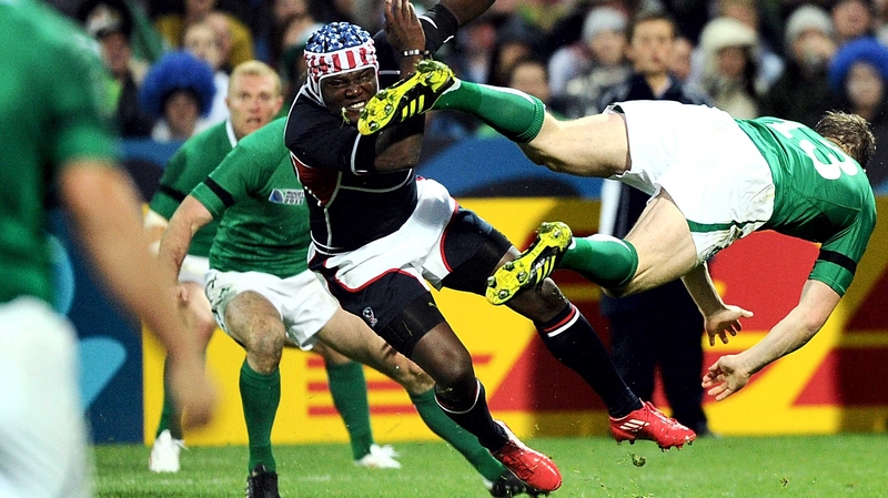 Ireland's Brian O'Driscoll (R) goes flying after colliding with with USA's Takudzwa Ngwenya during the 2011 World Cup