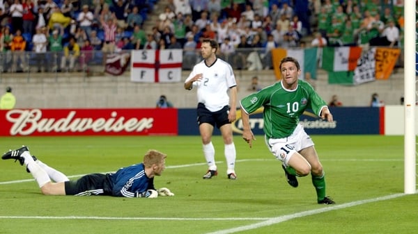 Robbie Keane wheels away in celebration after scoring late on against Germany at the 2002 World Cup