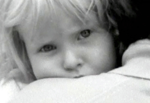 A refugee child on her mother's shoulder. (RTE Archives)